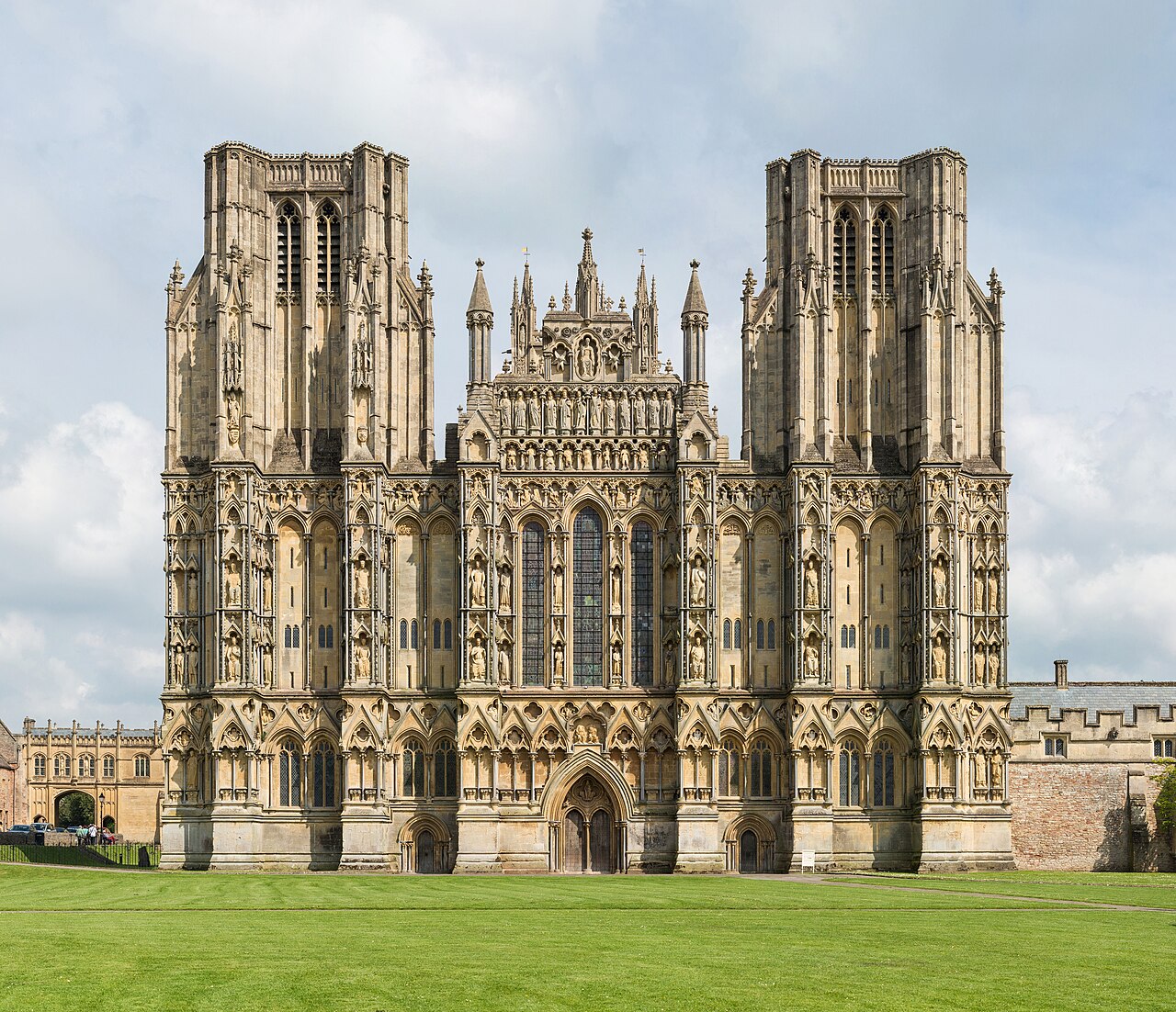 The carved west front of Wells Cathedral under a blue sky